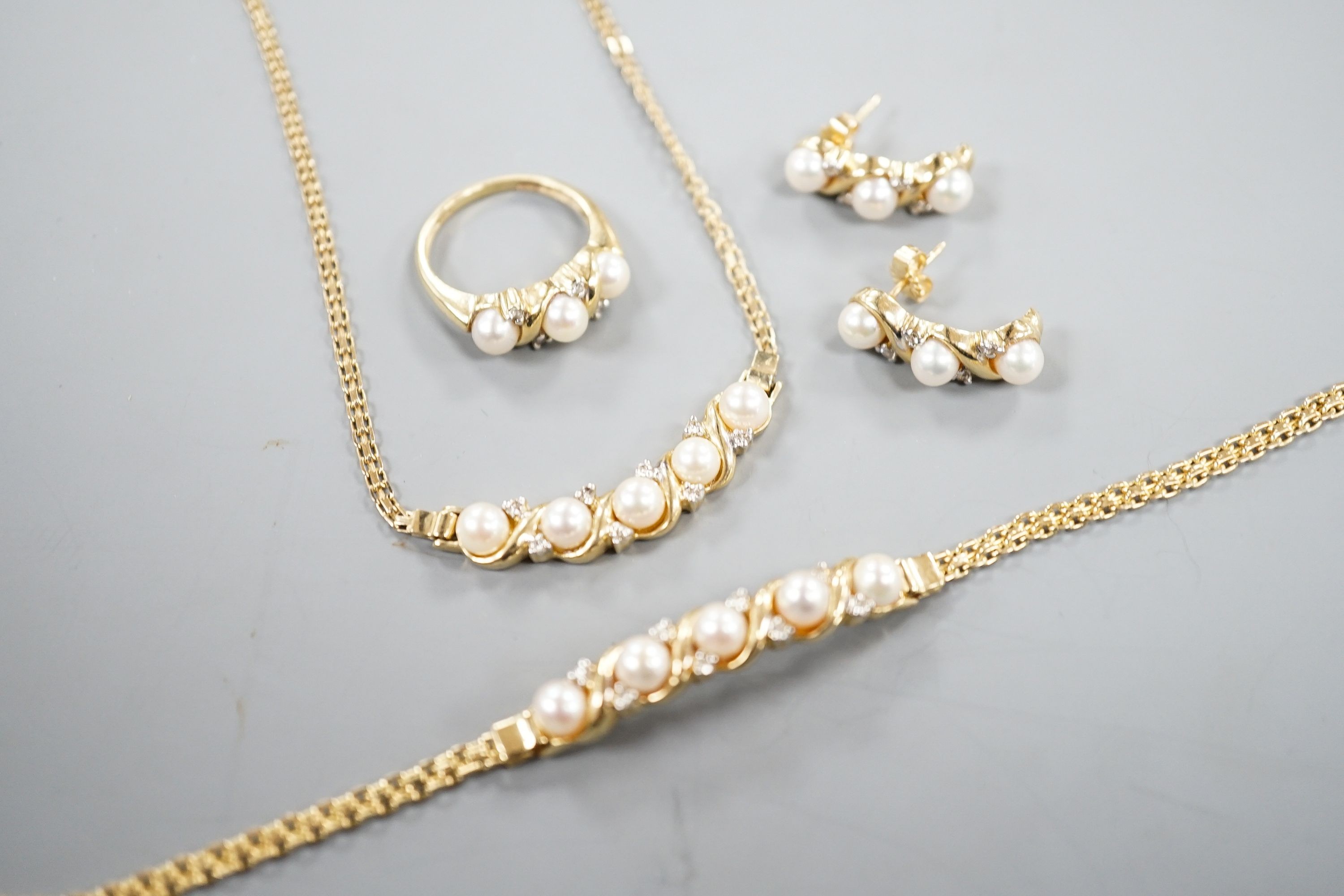 A modern matching suite of 14k yellow metal, cultured pearl and diamond chip set jewellery